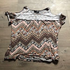 a shirt with shoulders showing